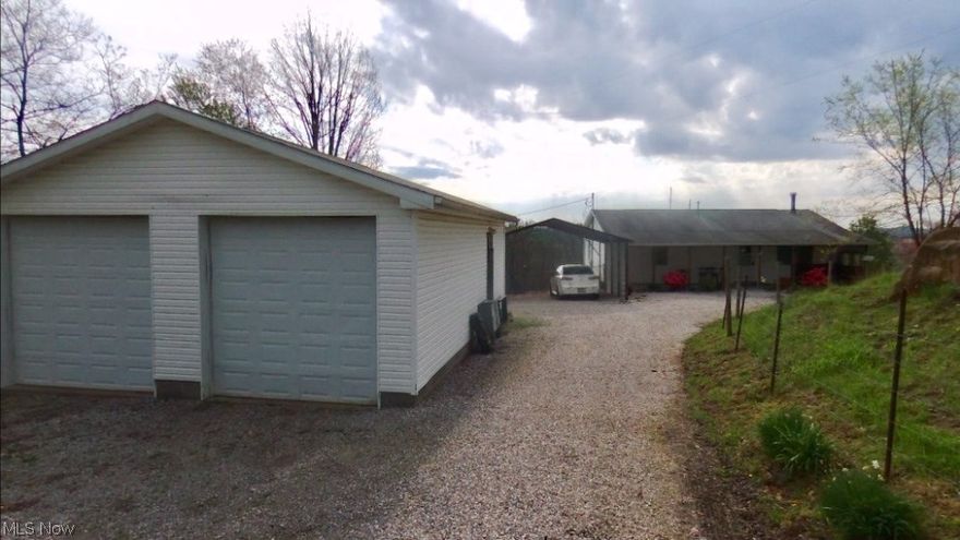 This won't last! Ranch home located approx 5 minutes from I77 & US 50. Located outside the city with privacy, 2 acres, unfinished basement allowing for expansion., 2 large bedrooms and baths on main floor and double detached garage.