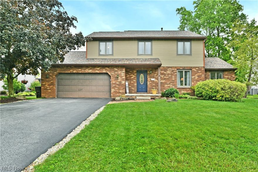 Hurry in for the summer, stay for a lifetime of fun and memories! You’ll have plenty of room to make them too, as this delightful Champion estate finds you with three floors of finished living space to include its partially finished basement. Instantly attracting with its handsome brick accents, manicured landscaping and stone-laid sidewalk, the residence packs a curb appeal punch that continues into the fenced-in backyard. Here, welcome the summer days ahead while relaxing in the crystal-clear pool, lounging on the expansive deck work or by shooting some hoops on the half court. A cozy fire pit looks on, awaiting the nightlife. Step inside to find a rising, wood trimmed staircase as a carpeted living room beckons you near. The sprawling central kitchen includes a large center island, hidden pantry and a neatly tiled backsplash. Eat-in dining looks on while taking advantage of the patio entrance provided sunshine. Curl up with your favorite book as you immerse yourself in the fireplace laden family room, complete with artful, overhead beams that pair well with the hardwood style flooring below.  A half bath rounds out the floor near garage and basement access where laundry services are also found. Upstairs, four impressively sized bedrooms branch from the main hall to include the oversized master suite and its included full private bath. A second, colorfully appointed full bath joins the engaging bedrooms at mid hall. Call today to be first through the door!