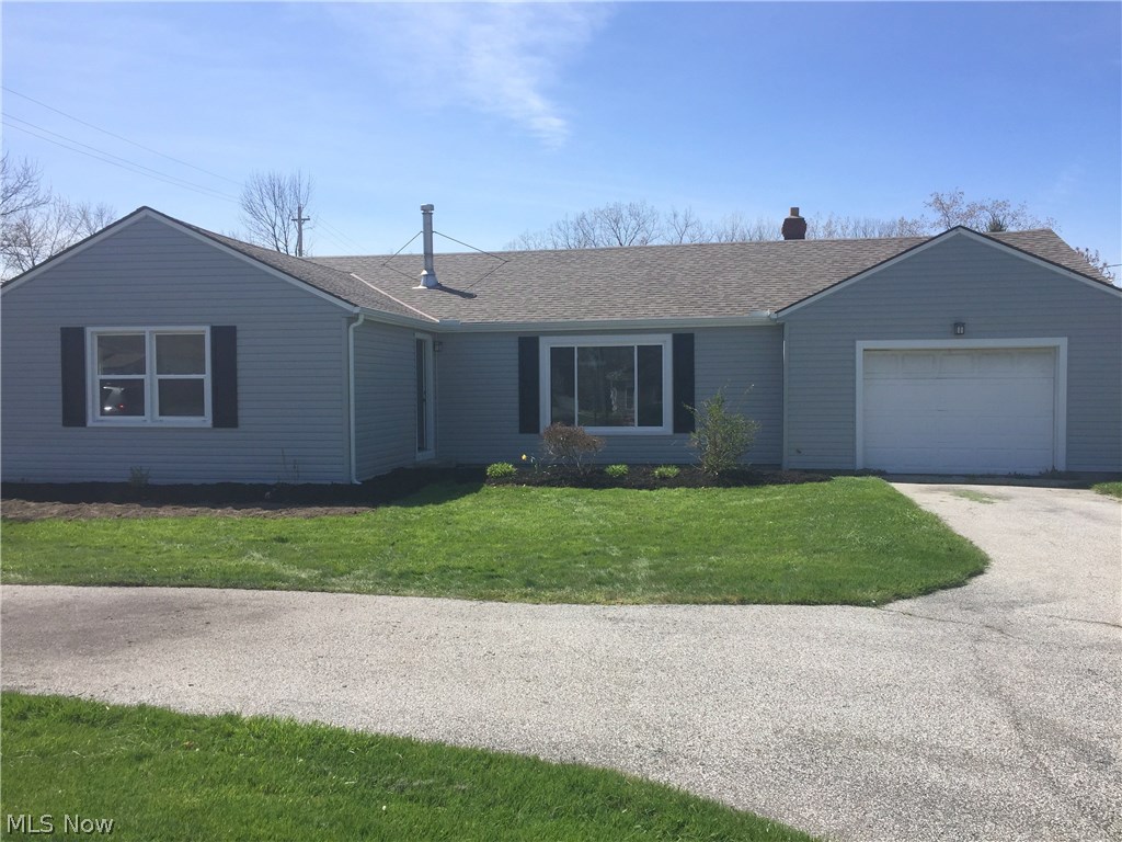 Move right in to this gorgeous 3 bedroom ranch in the heart of Mentor! Situated on the corner of Reynolds Road and Farnham on nearly an acre of property. Lots of updates in this home! As you pull into the driveway, you will notice the new vinyl siding, gutters and front living room window all installed in 2015. The original hardwood floors greet you upon entering the front door. You will also notice the recessed lighting throughout the living room in addition to the wood-burning stove. Entire house has been freshly painted along with the bedrooms all receiving new carpeting. Enter into the dining room and walk through your new sliding glass door that takes you onto the large, two-tier deck. The main attraction in this remodeled ranch is the completely updated kitchen! Custom white shaker cabinets, granite countertops, and stainless steel appliances are just a few of the perks. The bathroom also has been remodeled with ceramic tile flooring, new vanity, and a tiled tub surround accente