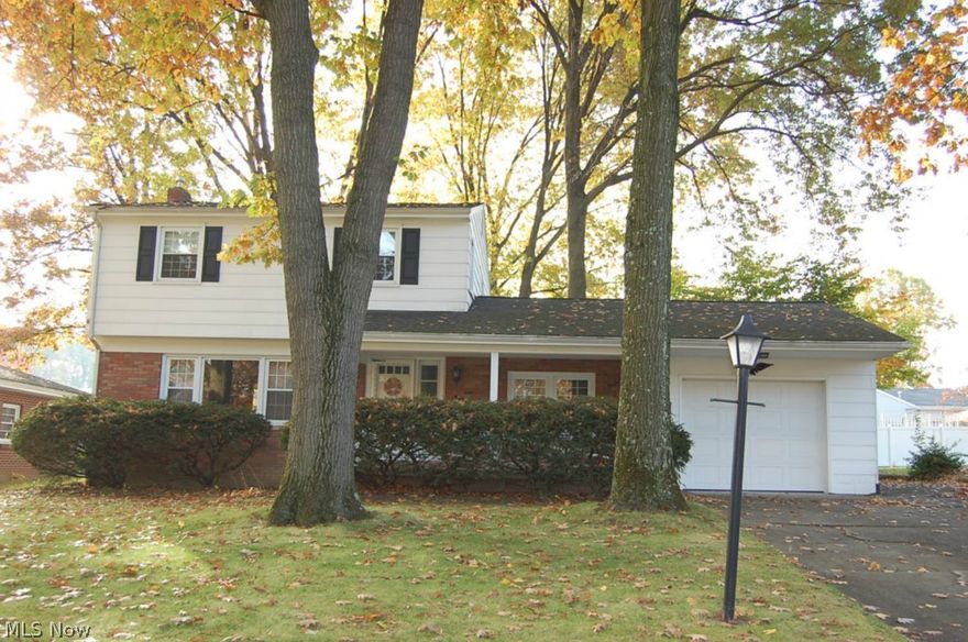 Solid 2 story home in a great neighborhood.  Features living room, dining room, kitchen, family room.  This home has beautiful hardwood floor on 1st and second floor, 2 1/2 total baths one being in the basement.  Newer vinyl windows and new high efficiency furnace with air, new garage door, 10x9 shed and enclosed back porch 27x9.  There is an extra wide concrete drive beside garage for 1 car.