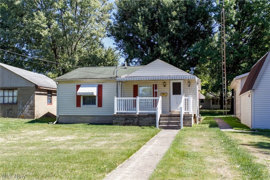What a dollhouse! Easy to maintain with everything on the first floor, this home has newer carpet in both the living room and bedroom.  The eat-in kitchen is huge with vaulted ceiling, oak cabinets, and large pantry for storage.  A full bath is nearby and features a tub/shower combo and linen closet.  The basement has even more storage space and laundry area with washer and dryer included in the sale!  Step outside the back door to a covered patio with walkway to the newer garage with opener.  There is also a 16 x 20 workshop with loft beside the home, perfect for the hobbyist.  Updates include furnace 2001, water heater 2011, garage 2012, siding & downspouts on barn 2012 -(approximate dates.) Perfect for those just starting out or ready to downsize!