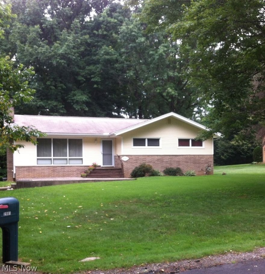 Nice ranch located one block away from walking and bike trails at mogadore reservoir and the end of a dead end street, plenty of privacy. Three (3) bedrooms, two (2) full baths, 2 car attached garage, open living and dining room with cathedral ceilings.  Partially finished basement that walks out to your private backyard overlooking a ravine. This home is ready to move into.