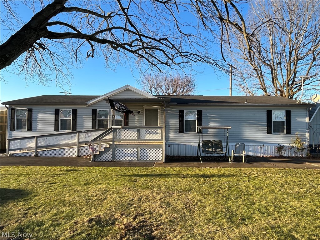 This is a charming and well maintained modular home located at Fairview Manor Mobile Home Park. The turn key property offers 3 bedrooms, 2 bathrooms, a 2 car detached garage, and a large utility building. Throughout the home, you'll notice it's all handicap accessible with a composite decking ramp that leads inside. The master bathroom offers a large garden tub perfect for an evening of relaxation. All kitchen appliances will convey to the new owners. You don't want to miss out on this open concept home! Call today to schedule your private showing!