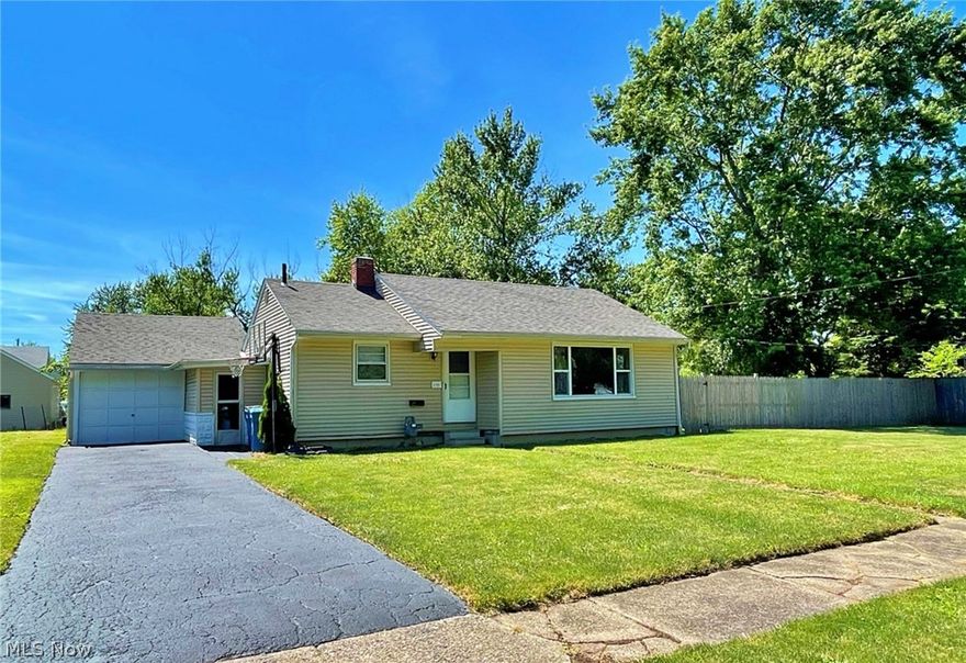 Welcome to this charming one-story ranch home in Lorain, perfect for cozy living! Featuring two spacious bedrooms and one bathroom, this home boasts beautiful hardwood floors throughout the living room and bedrooms. The basement, completely restructured in 2005, includes reinforced walls with steel beams, offering both durability and peace of mind. Enjoy outdoor living with a good-sized front yard and a large, fully-fenced-in backyard, ideal for pets and gatherings. An attached one-car garage provides convenient parking and storage. This delightful home is ready for you to move in and make it your own!
