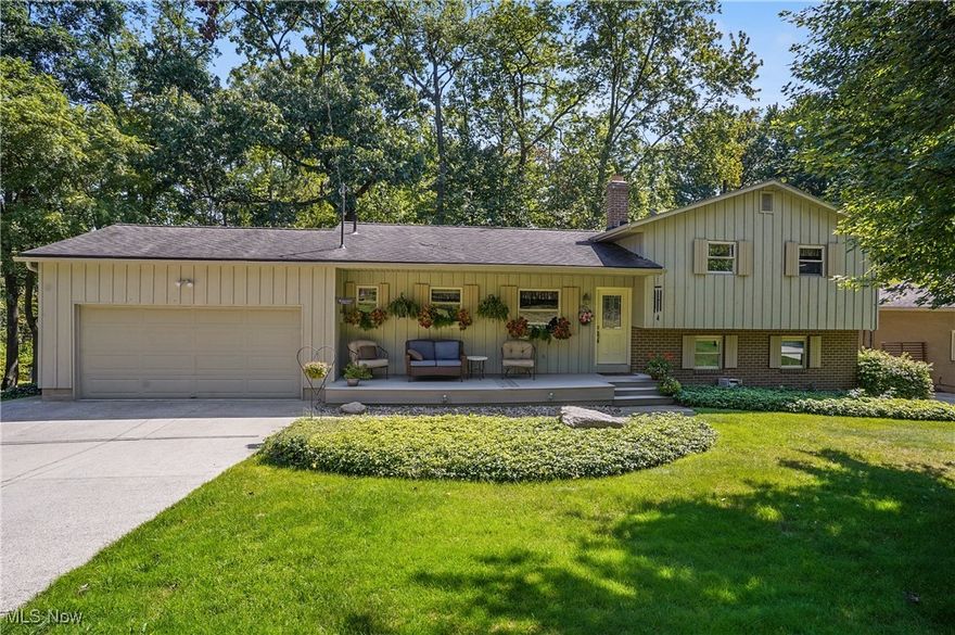 532 Alandale Dr, Tallmadge, Ohio 44278 This is the beautiful home you have truly been waiting on! 4 Bedrooms and 2 full Bathrooms with 3 Bedrooms and Full bath with access from the Primary Bedroom on the top level and one bedroom and full bathroom on the lower level is awesome for the multigenerational living or having a great guest suite! The property has a gradual slope so water is always going away from the home, the driveway was expanded for more parking and the rear deck overlooks the serene rear yard with plenty of room for family, friends and pets to have lots of activities! The main level of the home has a beautiful entry that leads to the huge living room with picturesque view from the rear windows, great sized dining room open floor plan and the eat in kitchen! There is also a half bathroom just between the kitchen and garage entry and the garage accommodates 2 vehicles and all your gardening tools yet there is a shed for more storage too! The beautiful hardwood flooring makes the home feel very welcoming along with the natural sunlight and the gorgeous trees and views from the exterior. The lower level  bedroom is the current owners office and is great since tucked away from the rest of the home especially with the full bathroom next to it. This level also has the gorgeous Family Room with fireplace and wonderful built in cabinetry and shelving. The well lit basement level houses the utilities including 2024 electric panel, high efficient furnace, water tank and storage shelving as well as  a work bench and laundry! I can see the owners sitting on the welcoming front porch with beautiful flower boxes admiring the meticulous landscaping in this awesome, quiet neighborhood. The property is in the highly sought Tallmadge School District with public utilities on a great street off of Howe Rd with easy access to Rt 261, Rt 91 and plenty of eateries, shopping and hop skip to Route 8. The property includes a one year home warranty for the Buyer's peace of mind.