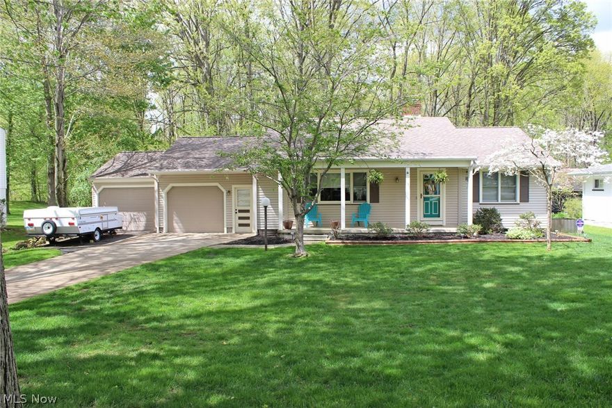 Start packing after viewing the beautifully updated Ranch in Champion!  This 3 bedroom 2 full bath home offers a gorgeous updated kitchen with new cupboards, granite counters, ceramic back splash and flooring.  All appliances stay.  The large living room, dining room and hallway boasts beautiful new African Cherry wood flooring.  The 1st floor bath features ceramic tiled shower walls, floors and a gorgeous double sink vanity!  The fully finished basement offers a large family room with a cozy wood burning fireplace, a bar for entertaining, a spacious bedroom, another full bath and plenty of storage throughout.  Enjoy the summer evenings on the patio off of the sliders overlooking the beautiful backyard that backs up to woods for privacy.  Updates include:  new bath - 2016, kitchen range - 2015, Dishwasher - 2011, Furnace - 2010, Updated Electrical Service - 2010, new carpet in bedrooms.  This home qualifies for 100% USDA Financing!!  Call for your showing now!!