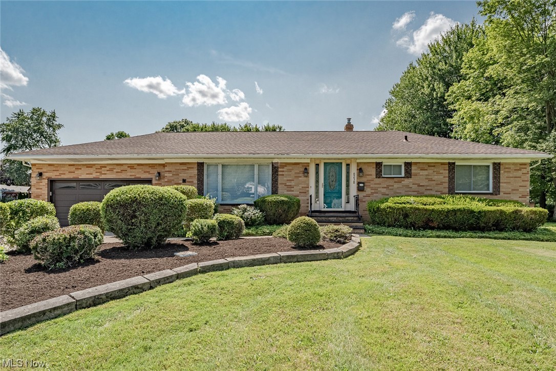 Move right into this well-kept ranch on a 0.69 acre lot in Solon! Situated on a quiet street, this lovely home features over 1800 square feet of living space with 4 bedrooms, 1.5 bathrooms, spacious sun-filled living areas, a tastefully updated kitchen, crisp neutral paint, and more. The front door opens into a very spacious living room with a picture window, beautiful terazzo tiling at the entryway, and updated LVT flooring that flows into the eat-in kitchen. Here you will find a full complement of stainless steel appliances, updated cabinetry, a lovely tile backsplash, and a generous eat-in area. Head back to the spacious family room that features a sliding door to the back porch. There is a very spacious bedroom just off of the family room. Down the hallway from the kitchen are three sizable bedrooms, all with gleaming hardwood flooring. The smallest room has been converted to a laundry room but could easily be reverted back to a bedroom. Situated next to the bedrooms is a completel