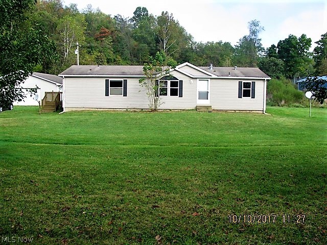 Fantastic location! This 3 bedroom 2 bath manufactured home on a full foundation boast 4.88 acres of land right off of US 36. The property also has a detached 4 car garage wit cement flooring for all of your vehicles and/or toys. Don't miss out on this at this price. Call today for your showing.