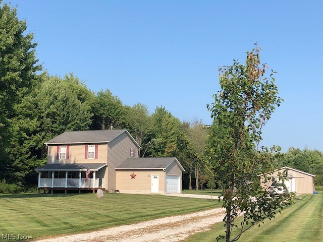 Beautifully maintained Country home resting on over 5 acres of property! This private setting is one of a kind! The home is immaculate with neutral decor throughout. The large relaxing front porch greets you upon entering the home. The foyer has ceramic tile and there is a walk in closet with shelving. There is a spacious living room that opens to the large eat in kitchen that has a sliding glass door that leads to the back deck-perfect for outdoor parties or sipping a glass of wine after a long day while admiring the views! The kitchen has ceramic tile floors that extend to the first floor laundry/mudroom and into the half bath. The second floor has 3 bedrooms and 2 full baths. The master bedroom overlooks the backyard and had a private bath. High efficiency furnace and air conditioner were replaced in 2015 and hot water tank in 2017. The concrete crawl has a newer sump pump, 2 car garage with opener, 12x12 shed and 32x32 outbuilding with new concrete floor, wood burner, electric and