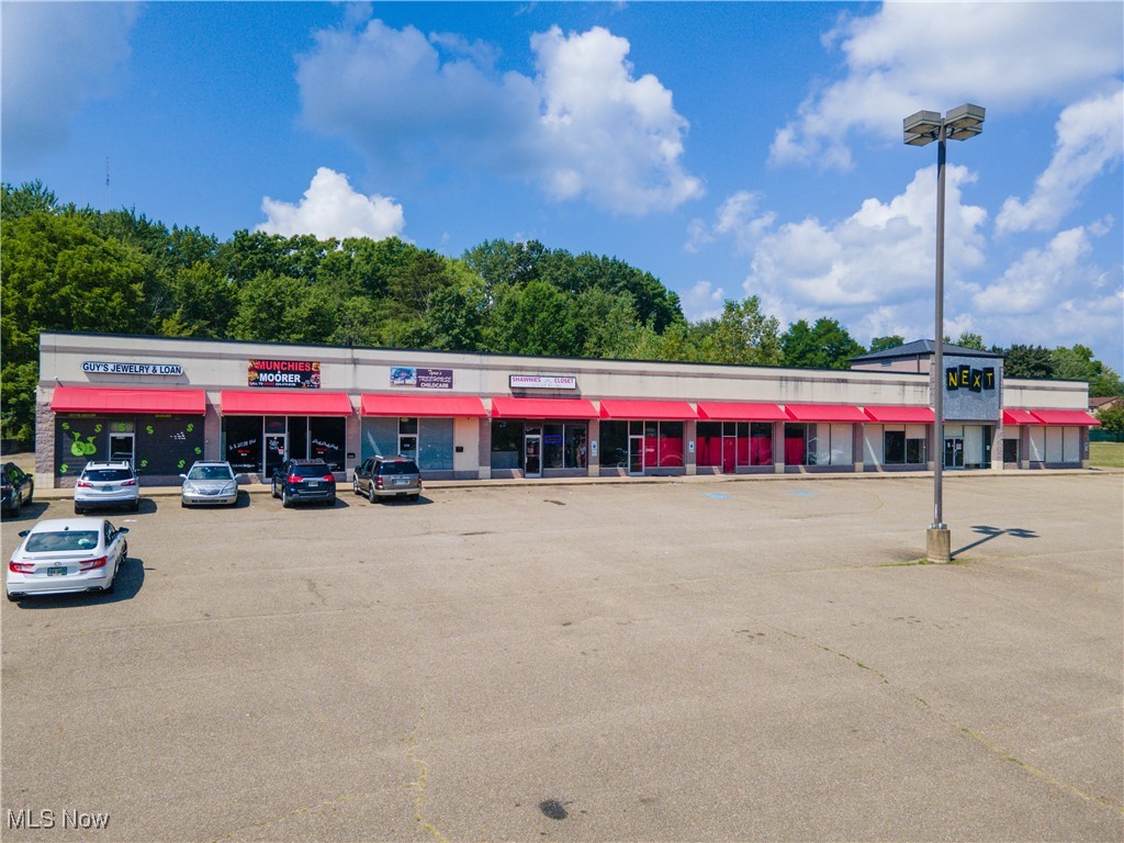 ABSOLUTE ONLINE AUCTION, Begins Ending 09/30/2025 at 6:00 PM, Parcel 1 | Here’s a rare opportunity to acquire prime commercial property in Akron, OH, just minutes from the Amazon Fulfillment Center and surrounded by new apartments and mixed-use development. The property offers excellent visibility along Romig Road and Vernon Odom Boulevard in a growing retail corridor anchored by Aldi and other national retailers.
Parcel 1: Six-unit commercial building on 3.686 acres, including ~1 acre of wooded land with harvestable timber. Three access points—two on Romig Road with 290 feet of frontage and one on Vernon Odom with 45.57 feet. The building has a mix of tenants and vacancies. The anchor space, previously leased for $7,000/month plus utilities, is vacant and available. Two units are leased at $1,000/month each. When fully occupied, the building can generate $10,000+/month. Units share one water meter; each has separate gas and electric. Upgrades include a 2024 AC unit and water heater in unit 2066. Zoned UPD-15.
Parcel 2: 1.065-acre vacant lot with 57.83 feet of frontage on Vernon Odom. Development-ready, zoned UPD-15, suitable for commercial, retail, or mixed-use.
Parcel 3: 1.043 acres with 103 feet of frontage on Vernon Odom and 30 feet on Marietta Avenue. Vacant, partially wooded, and zoned primarily UPD-15, with part under U-1 Single-Family, allowing flexibility for mixed-use.
Together, these parcels combine rental income with strong upside through re-tenanting, redevelopment, or new construction. Investors may bid on the commercial building, one or both lots, or the entire package. A unique chance to acquire income, acreage, and development land in a rapidly expanding Akron corridor.