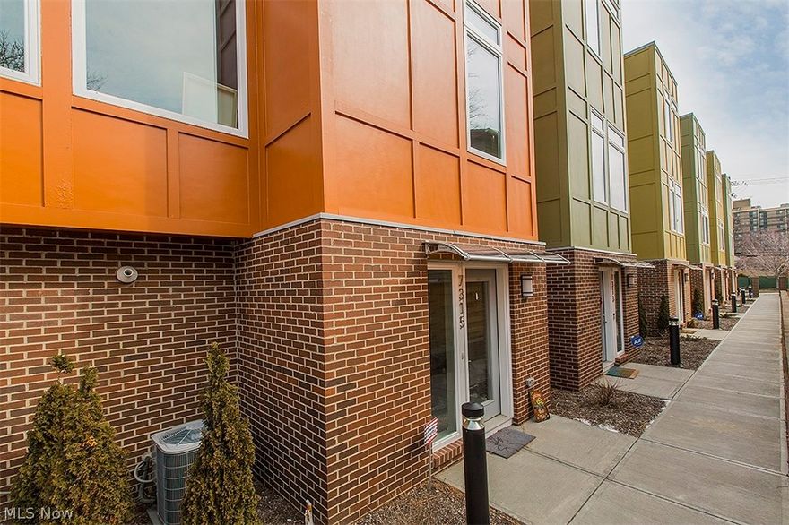 No time to build?  This less than one year old, corner unit townhome in the highly sought after Battery Park community, offers it all!  A 2-car attached garage opens in to an oversized foyer w/ upgraded engineered hardwood floors.  The main floor offers a spacious kitchen, eat-in nook, great room, & additional sitting area, ideal for a home office.  The kitchen features granite counters, cherry stained cabinets, & upgraded stainless steel appliances.  The center island has plenty of room for seating, making it ideal for entertaining.  With hardwood throughout the entire living area & tons of natural light, this space feels very inviting.  Your 3rd floor guest suite offers a hall bath & plenty of closet space. The owner's suite boasts a roomy walk-in closet & private bath, outfitted w/ a tile shower, granite vanity w/ dual sinks, & tile flooring. Take in all that this community has to offer on your 4th floor rooftop deck w/indoor rooftop bar!  Battery Park has three restaurants in the n