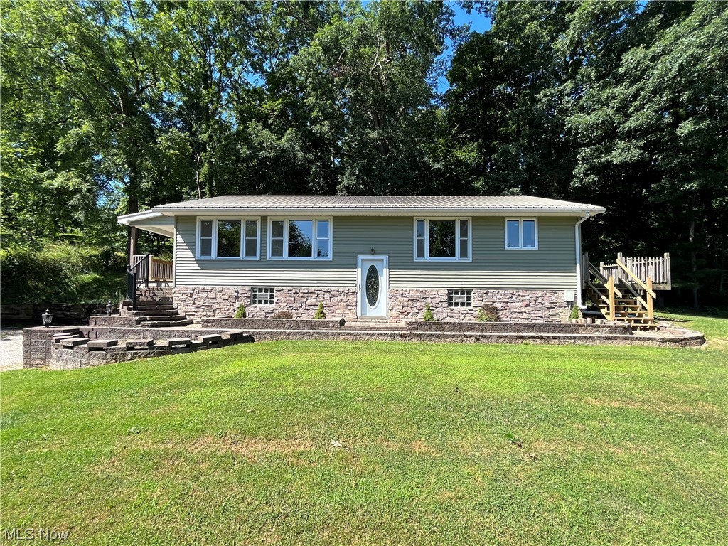 MUST SEE, Remodeled Raised Ranch Home in a rural location outside of Carrollton! This turn key home boasts 3 bedrooms and 1 1/2 bathrooms all conveniently located on the main floor. Great wooded quiet location with plenty of parking on almost a half acre lot. Enjoy the rural country setting on your recently remodeled porch, while only being minutes from downtown, shopping, healthcare, restaurants, schools etc. This home has too many updates to list including a new septic system, vinyl replacement windows, metal roof, stone/vinyl siding, all new interior, new appliances, new flooring, new hickory kitchen, quartz countertops and more. This home even has heated tile flooring in the main bathroom! The home currently is set up as a 1 car garage but has the option to easily be converted back to a 2+ car. The shared driveway has a recorded easement. High speed Spectrum internet available. Schedule your private tour today!