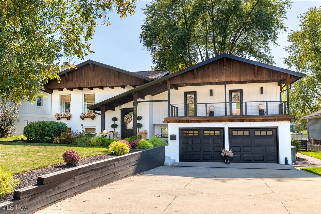 Welcome to 5775 East Boulevard, where lakefront luxury meets timeless elegance. Perfectly situated on the tranquil shores of Lake Cable, this extraordinary residence offers breathtaking panoramic views and a private dock, setting the stage for an exceptional waterfront lifestyle. Thoughtfully designed, this four-bedroom, three-bathroom split-level home features a bright, airy open floor plan that seamlessly blends comfort and sophistication. Expansive windows fill the living spaces with natural light while perfectly framing the picturesque lake vistas from nearly every room, creating a warm and inviting atmosphere.
The updated master suite is a serene retreat, complete with a private deck—an idyllic spot to savor your morning coffee or relax at day’s end while watching the sun set over the water. Ideal for entertaining, the upper-level great room provides an elegant backdrop for gatherings, celebrations, and cozy evenings with loved ones. The lower-level recreation room, anchored by a charming fireplace and offering convenient walk-out access, is perfect for both casual get-togethers and quiet nights in.
Step outside to discover a beautifully landscaped backyard designed for year-round enjoyment. A spacious multi-tiered deck overlooks the lake, offering plenty of room for dining, lounging, and hosting memorable outdoor events. Lush green space leads down to the private dock, where endless days of boating, fishing, and lakeside relaxation await. Impeccably maintained and thoughtfully updated from top to bottom, this remarkable home is truly turnkey—inviting you to simply move in and start living the coveted Lake Cable lifestyle.
This home has been expertly updated and is fully prepared for you to move in and make it your own. Don't miss the opportunity to create a space that truly reflects your style!