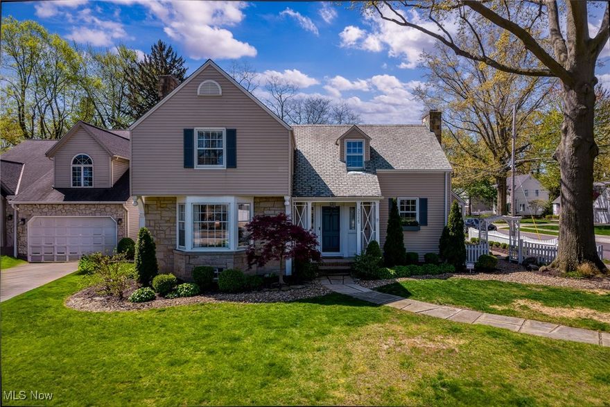 Perfectly positioned on the coveted south side of Lake Road, this beautifully preserved residence blends classic architecture with carefully curated, high-end improvements. From the resort-style outdoor living space to the refined interior finishes, every inch reflects thoughtful investment and exceptional care.

Inside, rich hardwood floors flow throughout over 2,300 square feet of living space. The sunlit living room offers a warm welcome and transitions seamlessly into a formal dining room, complete with a large bay window overlooking the serene backyard. French doors open to a first-floor home office — ideal for remote work or a quiet retreat.

The expansive primary suite, added in 2021, feels like a private retreat. It features a spa-inspired marble wet room with a walk-in shower and soaking tub, a single custom vanity, and a spacious walk-in closet — all designed with refined materials and an eye for detail. Two additional bedrooms offer built-in window seats and generous closet space, full of original character.

Significant mechanical and structural updates ensure long-term comfort and value. These include newer furnaces and air conditioning units, a new on-demand hot water tank (2021), and meticulous maintenance of the home’s original slate roof — preserving its beauty and durability for years to come.

Step outside to discover an entertainer’s dream: a custom patio with a full outdoor kitchen, surrounded by a large, landscaped lot that’s both functional and private. A two-car attached garage completes the package.

This is a rare opportunity to own a truly special home — meticulously maintained, tastefully updated, and located in one of Bay Village’s most desirable neighborhoods.