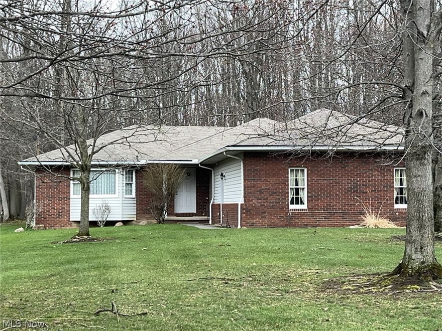 This house provides the finest in Intergenerational Living in a ranch that is essentially two houses in one. There is an In-Law floorplan on one side of the house. Walk in to find a large Living Room, Dining Room, Kitchen and Family Room.  There are two bedrooms and a full bath on that side of the house. Included in the In-Law area (on the other side of the house) is a second kitchen, another living room, bedroom and full bathroom.   The hallways are wide and there are some ADA doors.  For added convenience, there is a first floor laundry room and a half bath.  The basement holds endless opportunities, as it is nearly 2400 square feet. There are two decks -- one on the side of the house off the second kitchen and one in the back off the Family Room.  From there you can enjoy the views of a scenic, wooded backyard.  The MetroParks Bedford Reservation is just beyond the backyard. Walton Hills offers good services, lower taxes and easy highway access. The seller prefers to sell the house "AS IS", 
but is offering an America's Preferred Home Warranty. Come see 17615 Alexander Rd. and be pleasantly surprised with how much this house has to offer.