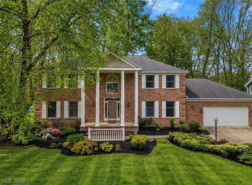 Experience quality upgrades from top to bottom in this immaculate brick home in Heritage Woods, within the Revere School District. This 4-bedroom, 3-bath residence sits on a newly landscaped lot and features a stunning two-story foyer with an integrated granite design and a dramatic wrought-iron staircase, opening to the living room or study and a large formal dining room. The kitchen is a chef’s dream with granite counters, stainless steel appliances, a bar area, and an island, all open to the eating area and the expansive family room that includes a cozy fireplace and sliders to a generous outdoor living space with a patio and deck for seamless indoor-outdoor entertaining. There are also french drains installed.  The first floor also includes a well-designed laundry/mudroom right off the garage.. On the upper level, the spacious primary suite offers a walk-in closet and a fabulous newer bathroom featuring custom built-ins and a large marble shower with three shower heads, a towel warmer. A second full bathroom with a custom vanity, granite, and a tiled shower servicing the other three bedrooms. The finished lower level provides additional living space, a separate office area, and ample storage. The home has just been freshly landscaped, and a brand-new roof and gutters are scheduled for May 2026 ($45k), adding further peace of mind. This turnkey property is perfect for entertaining and everyday living in a sought-after neighborhood. A full house Kinetico water system installed in 2023, a hot water tank installed in 2023, a furnace installed in 2016 with a new humidifier installed in 2025.