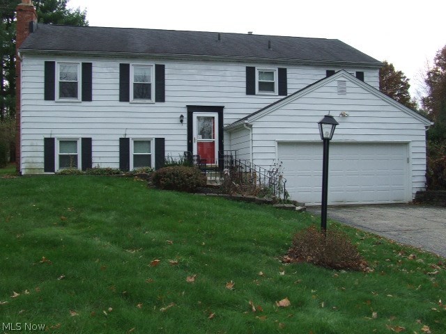Large Bi-Level with 4 bedrooms, 2 full baths, attached 2-car garage on almost half acre on quiet street but close to downtown Hudson. Beautiful hardwood floors in open living room and dining room, 3 bedrooms, full bathroom and large eat-in kitchen and sliders out to HUGE deck on upper level. Lower level has another bedroom and another full bathroom, plus large rec room with fireplace that could be a master bedroom with walk-in closet. Newer winds, all appliances including washer and dryer, newer furnace. See it today! **Summit County auditor's office ESTIMATED TAXES will be $4569.