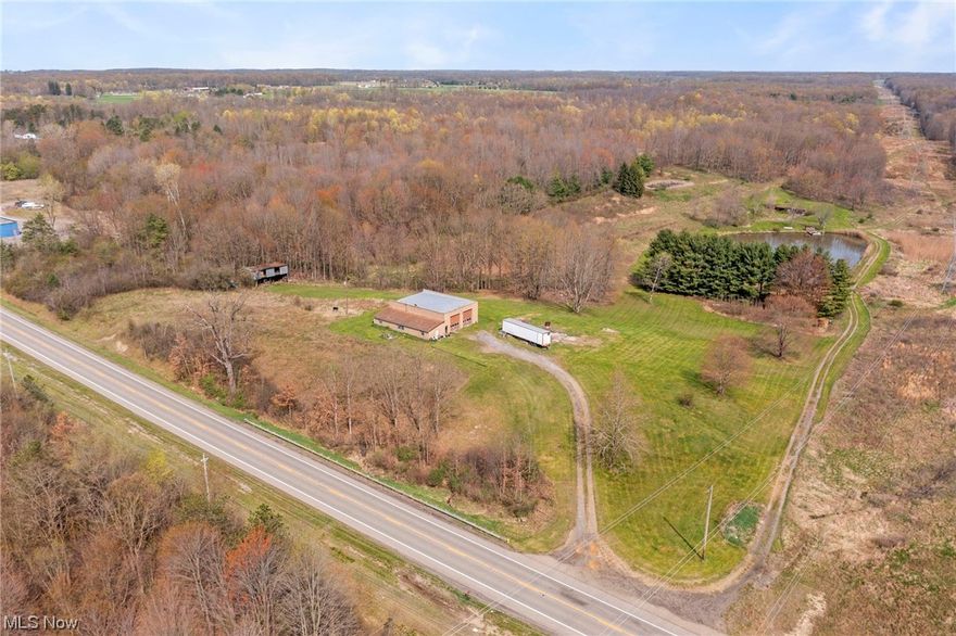 Stunning Property Is Beautifully Situated On 30 Sprawling Acres of Land. One of The Highlights Of The Property is The Massive 3364 Sq. Ft Outbuilding with Attached Apartment and Car Lift, Perfect for Storing Equipment, Vehicles or For Use Of a Workshop. Commercially Zoned With Potential To Run Profitable Business. Prime Location On Rt 224 in Ellsworth Township. In Addition to The Workshop You Will Find A 3/4 Stocked Pond, The Property Is Stunning Featuring Lush Natural Landscape, and Plenty Of Space For Additional Construction. The Surrounding Acreage Offers Ample Opportunities For Activities, From Hiking, Hunting, Gardening And More. Overall, This Property Is A Rare Find Offering A Perfect Blend Of Commercial Opportunity And Natural Beauty. Don't Miss Out On This Incredible Opportunity To Own This Expansive Acreage In A Prime Location. Property Is Zoned Commercial But Has Existing Residence. Gas Well On Property With Free Gas.