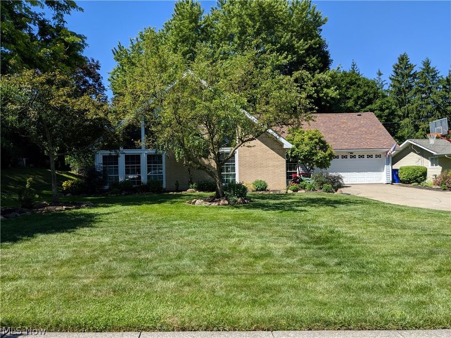 Updated and well maintained contemporary in Four Seasons ready for it's next owner.  The back yard looks over the Four Seasons park which features a swimming lake, pavilion, basketball courts, and playground.  This home is one of a kind in Four Seasons with a large family room, updated eat-in kitchen with newer appliances perfect for family gatherings.  The master bedroom is located on the first floor.  A spiral staircase leads to 3 additional bedrooms upstairs, one with a fireplace and deck.  Another upstairs bedroom has two built-in beds with large closets and plenty of storage.  Newer floors and carpet run through the home.  A beautiful well cared for home in the perfect Four Seasons location waiting for it's next family to enjoy.