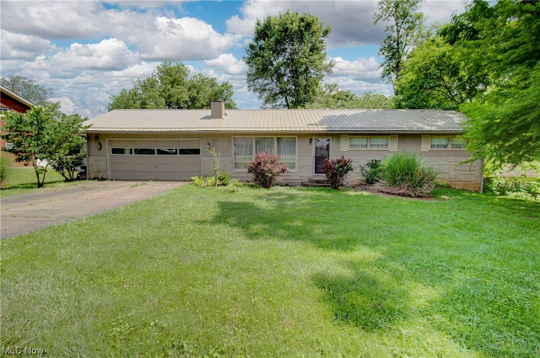 This ranch home on the north end of Zanesville is located in the West Muskingum LSD with 3 bedrooms, 2 1/2 baths and a 2 car attached garage! One owner for over 50 years! There are beautiful hardwood floors throughout much of the home! It has public water & sewer and high speed internet is available too! There is a full, walkout basement that could be finished for additional living space! This home has so much potential to make it your own! With .58/acre, there is a spacious front and back yard! Call today for more information! Property being sold AS-IS.