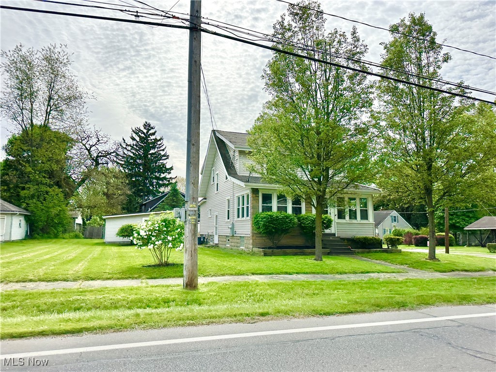 Beautifully updated 3-bedroom, 1.5-bath home, ideally situated on a spacious double lot. This home offers the perfect blend of character and convenience with features like updated kitchen & both baths, an oversized 2-car garage and classic architectural details throughout.
Enjoy the warmth of a formal dining room complete with built-in cabinetry—perfect for hosting or everyday dining. Relax year-round in the stunning four-seasons sunroom with panoramic views, or step outside onto the oversized deck, ideal for entertaining or enjoying peaceful evenings outdoors.
With room to grow and timeless features, this home is a rare find in the heart of Mogadore.