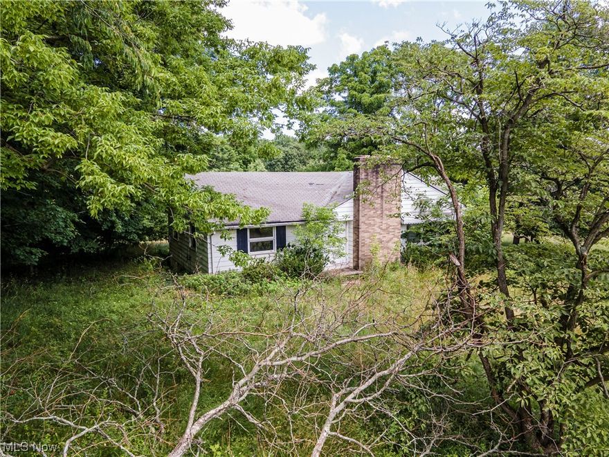 A slice of paradise with this ELEVEN+ acre hide-away in the middle of urban living! This property offers a solid 3 bedroom, 1.5 bath home well hidden from Sourek Trail. The sizeable windows offer 360° views of this amazing acreage. The possibilities are limitless! With a little love and sweat equity, this property will spring back to life. Don't hesitate, priced to sell in a competitive market. Contact me for your private showing. Please do not walk the property without your agent and an approved showing.