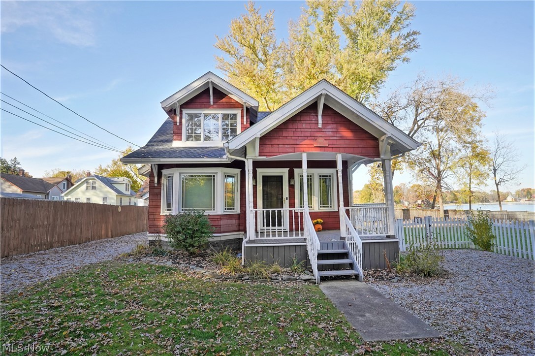 Welcome to this charming cape cod right on Portage Lakes! This home not only has stunning views of the lake, but a huge fenced in backyard! When you first step into this home you will not miss all the sunlight shining in from all the windows! The family room boasts a fireplace with darling built-ins next to them. Off the family room is the dining room with a lovely window seat and beautiful windows to allow the natural light to shine in. A large kitchen with plenty of cabinet space and a sliding glass door for access to the deck that overlooks the lake. Two nicely sized bedrooms. Do not miss out on this stunning home on Portage Lakes!
