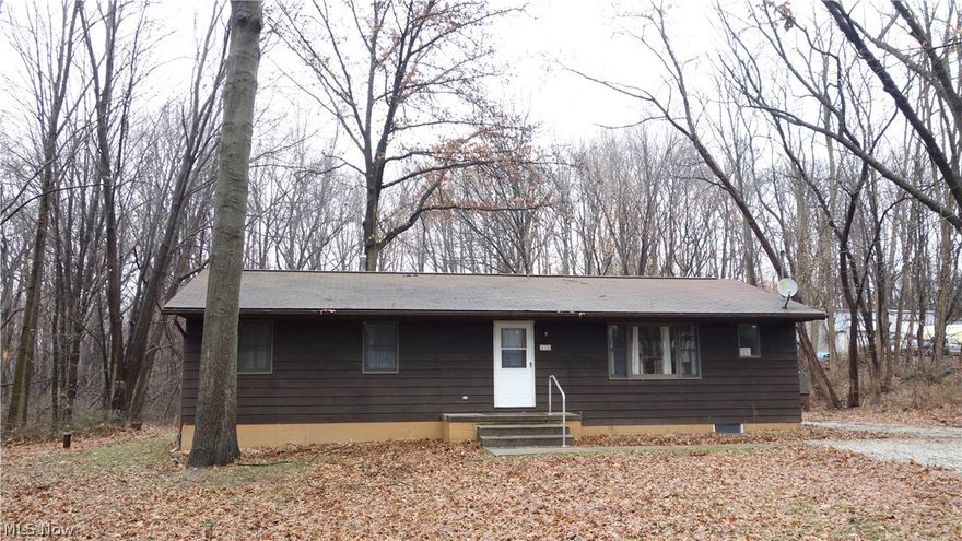 "2 1/2 Acres of Exceptional privacy" with spectacular seasonal views that compliment this *hidden ranch* w/a Jumbo 2.5 car garage & shed!  A well-cared for home @ the end of a dead end private road, nestled on a woodsy & picturesque lot, room to park your RV, boat, trailer, more!  Possibly build a pole barn, etc.  Freshly painted throughout, with rich oak floors in the living room & dining room that have an open floor plan to enjoy.  The lower level has approx. 400 sq. ft. of finished area w/ a 4th bedroom that accommodates many needs, a 2nd full bathroom and a family room.  The lower level also offers space to finish into a recreation room or workshop. Updates throughout, See attachments for well/septic Summit County transfer certificate & location survey, receipts. Located in the Portage Lakes area, very accessible to the x-way and just minutes to the Portage Lakes State Park w/ public boat launches (see photos), Turkeyfoot Lake Golf Course, shopping, dining, nightlife, more.  Seller