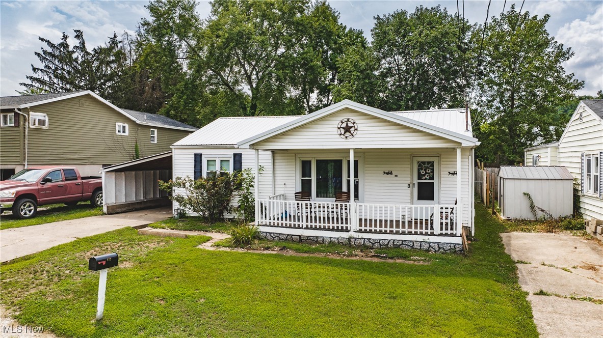 Welcome to 512 Victoria Avenue, an updated ranch full of charm and functionality in Parkersburg’s Nicelyville neighborhood on Southside. This 2-bedroom, 1.5-bath home offers 1,008 sq. ft. of thoughtfully designed living space with a warm, welcoming layout. Step into a spacious living room that flows easily into the beautifully updated kitchen and dining area, perfect for daily life and entertaining. The kitchen features modern cabinetry, pull-out pantry drawers, and included appliances, making meal prep a breeze. You’ll love the mix of hardwood, vinyl, and ceramic tile flooring throughout. The versatile enclosed patio or mud room provides extra space ready for your personal touch — previously used to house pets and may show some dirt, but offers great potential as a sunroom, hobby space, or storage area. Outside, enjoy a fenced yard ideal for pets or play, a covered front porch for morning coffee, a covered carport, and private off-street parking. Since 2020, this home has seen numerous updates including a durable metal roof and fresh interior finishes, and the seller is also leaving brand-new flooring materials for the new owner to use as they choose. Now vacant and move-in ready, this home offers immediate availability and endless possibilities. Conveniently located near schools, shopping, parks, and commuter routes, it provides easy living and great value. Whether you’re looking for your first home, downsizing, or investing, 512 Victoria Avenue is a welcoming canvas ready for its next chapter. Sellers are motivated — schedule your private showing today and imagine the possibilities waiting inside.