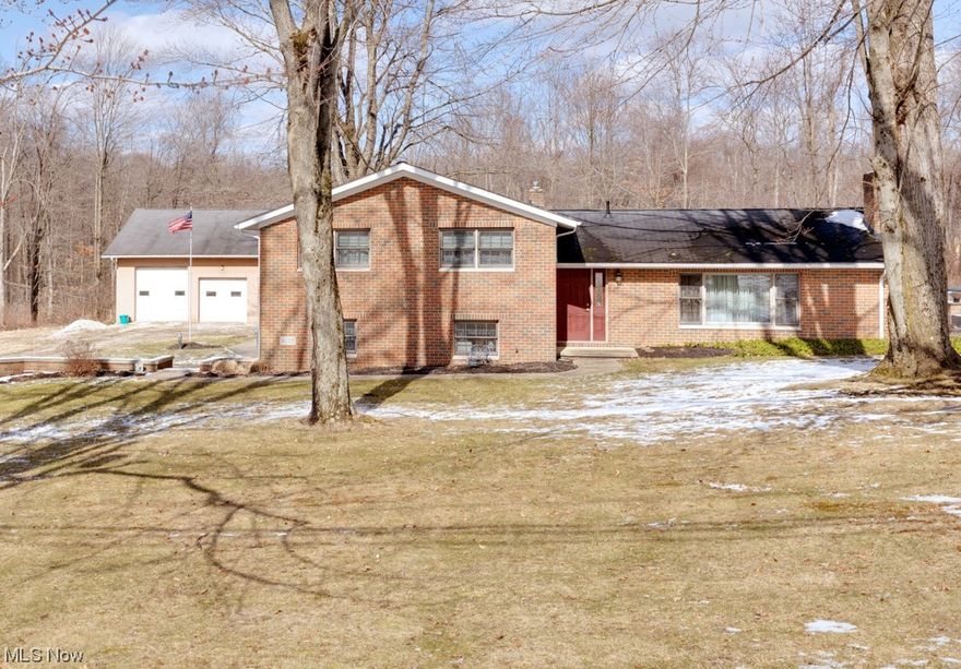 This lovely Shalersville Twp. home located at 4155 Webb Road has a lot to offer, especially if you love the outdoors! The home features 3 nice size bed rooms, 2 full bathrooms, a large family room on the lower level, an office with built-in shelves and cabinets, and laundry room. 
Additionally, you will find a spacious kitchen with beautiful cabinetry, granite countertops & matte stainless steel appliances, dining room with access to the deck, and a cozy living room with wood burning fireplace insert. Outside features include a paver patio with gas fire-pit, a large deck surrounding the heated above ground pool, and a heated 3-car garage with high ceilings, electric, walk-up storage loft, sink with water(including hot water), heavy duty garage doors with openers, and drains. All of this sits on 13.38 acres of land.
Schedule your showing today!