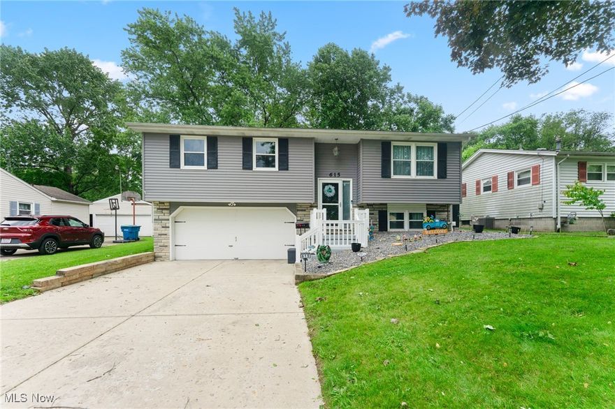 This beautifully revitalized 3-bedroom 2-bathroom bi-level home offers style, function and space in one of Hubbard’s most desirable neighborhoods. The exterior showcases dark blue vinyl siding, vinyl windows, dimensional shingle roof, a double-wide driveway, and a 2-car attached garage.

Step inside to a spacious open-concept layout featuring a modern kitchen and dining area. The kitchen is updated with gray soft-close cabinets, subway tile backsplash, stainless steel appliances, butcher block countertops, and luxury vinyl plank flooring. Additional cabinetry provides a tucked-away pantry area, and updated light fixtures add a modern touch.

The main living area is currently set as a large dining space with a statement light fixture perfect for hosting. A second living room sits at the back of the home within the rear addition, offering ample space, and access to a generous back deck overlooking the yard.

Three bedrooms on the main level offer great closet space and updated ceiling fan light fixtures. The full bathroom includes a tiled tub surround, new vanity, and updated toilet.

Downstairs, the lower level offers a potential fourth bedroom or flexible living space with carpeting, a laundry area with a shower and toilet, abundant storage, and a bonus storage room added with the home's expansion. Glass block windows, a 125-amp panel, lennox forced air furnace and AC installed 7/3/2025  and generator back-feed hookup add to the home's functionality.

Located in a walkable neighborhood near Jones Park, local restaurants, and grocery stores. Part of the Hubbard School District