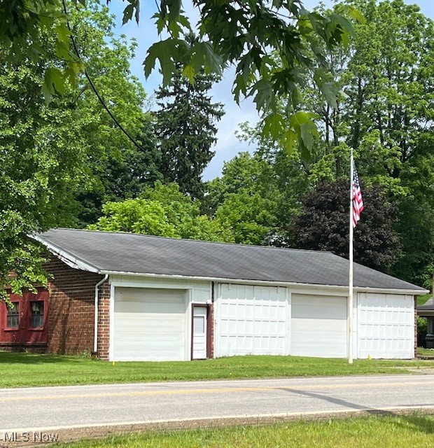 Huge garage located on State Route 9 in Hanoverton, Ohio. No zoning- one of a kind property on a spacious lot (70 x 132) featuring an impressive and incredibly versatile structure, originally the Hanoverton school bus garage. Built in 1940. Building 34 x 56 (1,976 square feet) block construction. This historic gem is in very good condition, offering a solid foundation for your vision. Garage has 4 bays featuring 9 ft. doors and 2 genie openers, providing ample room for vehicles, projects, or storage- a dream for hobbyists, contractors, or collectors. Sewer tap on site if connection is desired. Natural gas is available. Property taxes are only $393.14 annually. Unleash your possibilities!