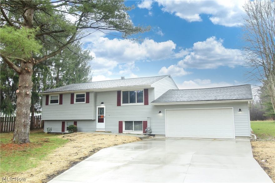 Gorgeous fully remodeled 4 bedroom/2 bath bi-level home on almost 2 acres.  This home offers a brand-new open concept eat-in kitchen overlooking the enormous back deck facing the Bath Nature Preserve. The kitchen has brand new gray cabinets, granite countertops, and a breakfast bar.  The brand-new flooring, fresh paint, and loads of natural light are only a few of the upgrades in this home.  The oversized bedrooms, glamour bath, warm and cozy living room finish off the main level.  The lower level features a stone wall, vinyl flooring, all new lighting, full bathroom and bedroom as well as a plethora of storage.  In addition to all the interior upgrades, there is an oversized 2 car attached garage, brand new siding, water softener, cistern (new in 2018) and new septic system which will be installed March 2022. This home is an absolute beauty inside and out on a scenic lot!  Call today for a private showing.