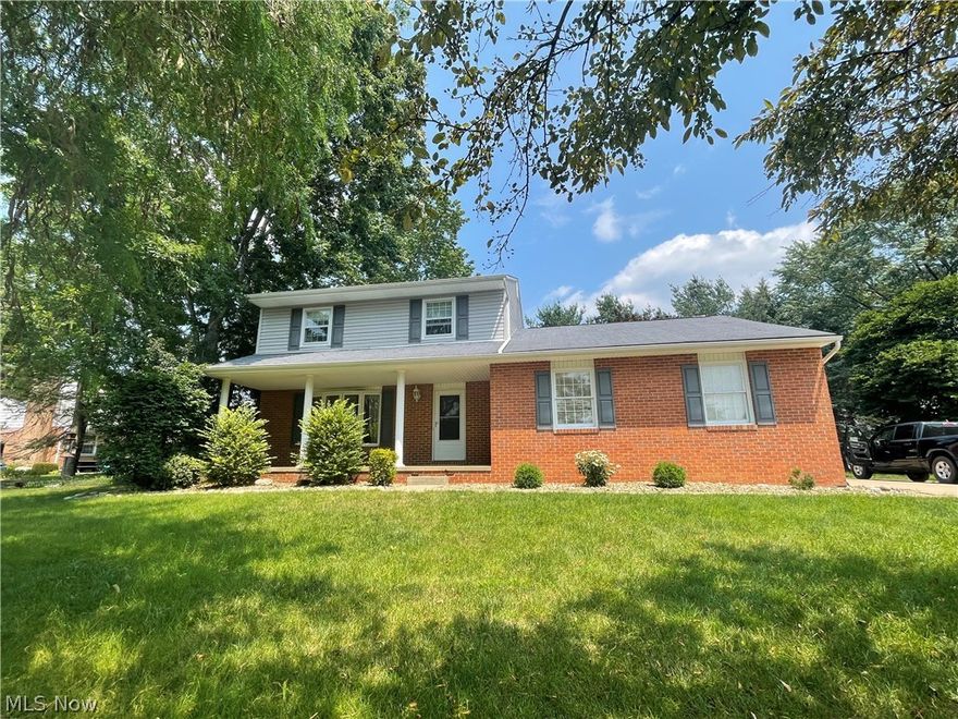 Your new home awaits you at 3508 Cardiff Ave NW in Jackson Township!  The covered front porch is the best place to talk to your friendly neighbors as they walk by.   A spacious living room with bay window is off the foyer.  The heart of this home is the kitchen with a large island with seating for 4 and extra storage,  and is open to the dining area that can accommodate your large gatherings.  A convenient half bath is around the corner and just inside the garage entrance.  The family room has a brick fireplace, recessed lighting, and access to the expansive deck with new floor boards.  On the second floor is the master bedroom with large closet,  2 additional bedrooms, all with ceiling fans, and an updated full bathroom.  A rec room with vinyl flooring is in the lower level, along with the laundry area, and lots of storage space.  There is a 2 car garage and a driveway with plenty of parking space.  The back yard has just been reseeded and is a nice flat area. This home is move-in rea