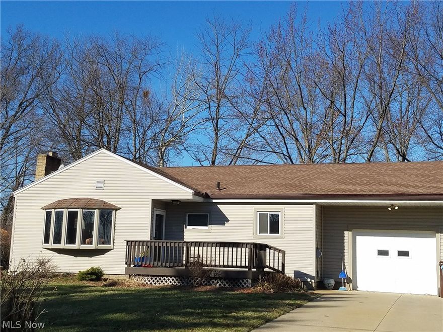 Updated ranch with partially finished basement and attached garage.