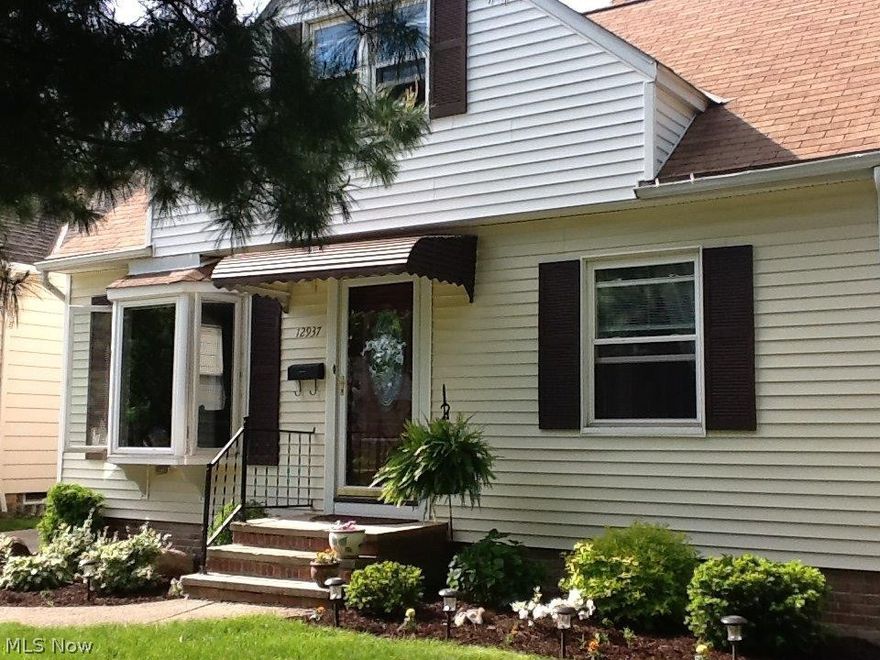 Welcome to this immaculate 3 bedroom 1.5 bath Cape cod. updated eat in Kitchen with appliances, Nice wood cabinetry, beautiful backsplash and tile flooring. Main bathroom has been updated.  2 spacious bedrooms down. Large Master suite up  w/dormer, generous closet, and newer laminate flooring. Finished basement with half bath, laundry room and plenty of storage . Replacement windows through out .   Improvements include wood flooring in bar area, living room, bathroom and hall. New carpet lower 2 bedrooms and stairs. Newer side, interior and exterior doors.  1.5 Oversized garage. Deck built in 2014 and beautifully landscaped yard. Nothing to do but move in! You wont be disappointed!