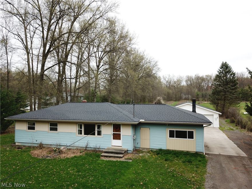 Welcome to 3799 Eakins.  Feels like the country, yet, a convenient location with access to Route 8 and 77 via the Valley.  This home is situated on a private, dead end street includes 2 acres, a large, 32 x 40 utility building that accommodate 5 cars, a shed and a large (16 x 24) partially covered deck overlooking the back yard.  Cuyahoga Falls City Sewer and Water = LOW UTILITY COSTS.  The setting here is just beautiful.  A ranch style home featuring 3 bedrooms and a full bath.  The kitchen was updated with oak cabinetry.  There is a wood burning stove in the family room.  There is a bonus room (formerly a garage) that just needs drywall finishing and flooring to be a huge addition to your living space (not included in the square footage).  There is a large, full basement with a smaller, finished room that is perfect for an office.  Vinyl Siding, Windows, Roof, Hot water tank, gutters, were all updated shortly before the property last sold.