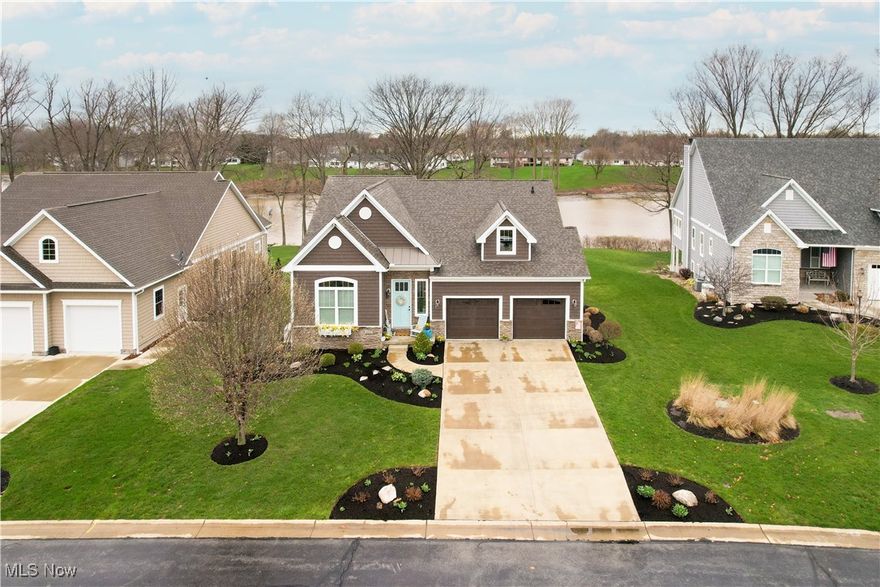 Exquisite Waterfront Living. This stunning property exudes charm & character. Thoughtfully designed with quality craftsmanship, the home features coffered ceilings, arched doorways, a spacious composite deck, generator, ample storage, two fireplaces, & soaring vaulted ceilings.The secluded master suite serves as a private retreat, boasting serene water views, a tray ceiling, a generous walk-in closet, & a luxurious en-suite bath. Three additional bedrooms provide comfortable accommodations for family & guests.The gourmet kitchen is both stylish and functional, featuring sleek quartz countertops, a spacious island, elegant white cabinetry, stainless steel appliances, and a convenient pantry-perfect for effortless entertaining. Whole house Generac generator. Enjoy the wildlife in your peaceful backyard. A newer staircase allows easy access to the water and your floating dock. Walk or golf cart to the nearby marina, golf course & restaurant/bar. This property is a rare find. Schedule your private tour today!