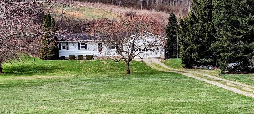 This property offers a well-rounded package of comfort and convenience! Ranch style home with a full walk-up basement offers convenient single level living with potential for additional expansion or storage downstairs. Large living room and additional family room provide plenty of space for family gatherings. Overall having a well-appointed kitchen with oak cabinets and ample counter space connect to dining room. 3 beds and 1 bath offer abundance of natural sunlight. Attached garage for convenience and spacious deck off the dining room. Tranquil fishpond and landscaping. Situated on 3.5 acres - livestock permitted - additional large building (needs tlc) Proximity of SR 16/60 - four lane highway only 5 miles Possession 30 days past closing/funding