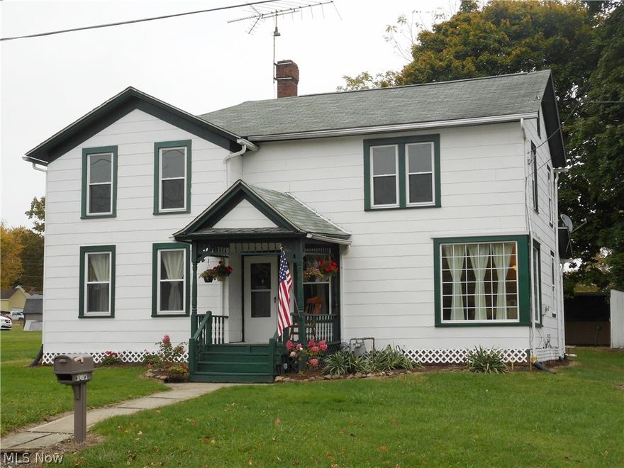 Welcome to this lovely home with its blend of quaint country charm and modern conveniences.  The light and bright updated eat-in kitchen features newer counters, kitchen cabinets and ample storage.  An inviting dining room, complete with wood burning stove, offers plenty of light and leads to the spacious living room.  Gorgeous wood doors, a detailed wood banister and arched doorways add to the character of this century home.  The 1st floor laundry room is large enough to include exercise equipment or an office, plus there’s a 1st floor half bath.  The 2nd floor features new carpeting (Oct 2016) and has 3 spacious bedrooms with great closet space.  The master bedroom even has a walk-in closet!  This home offers many newer windows, a huge 2.5 car garage with water, a shed, room for extra parking and a home warranty.  Take a stroll down memory lane and relax on the adorable front porch with its ornate railings and pretty flower beds.