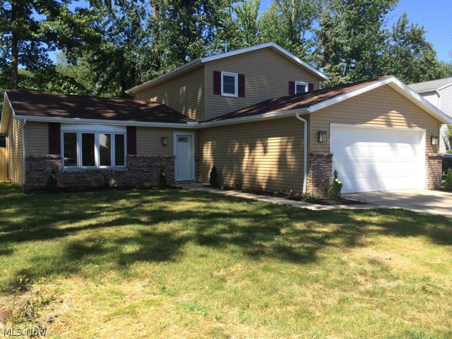 Gorgeous Colonial in desirable Elyria North Side.  4 Bedrooms, 1.5 baths, 2.5 attached garage. There is plenty of room for all!  Outstanding kitchen with granite countertops and granite island!  You will love to cook and entertain!  Brand new stainless steel appliances also included!!  More entertaining space on a nice wood deck and completely fenced back yard.  Completely and professionally updated.  Come see for yourself...