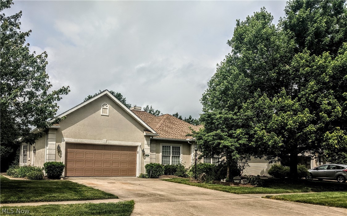 One floor living in attractive convenient north side location in Deer Creek. Fully applianced cherry cabinet kitchen with breakfast nook. Formal dining room with door to back porch. Living room w coffered ceiling and gas fireplace that opens to rear deck. Beautiful wood floors. Full master suite with walk-in closet and private bathroom. A second bedroom and den/3rd bedroom and laundry room complete the first floor. Lower level family room w gas fireplace. Great workshop room in the basement. Recent updates include: New furnace and CAC in 2020. New roof and deck in 2019.