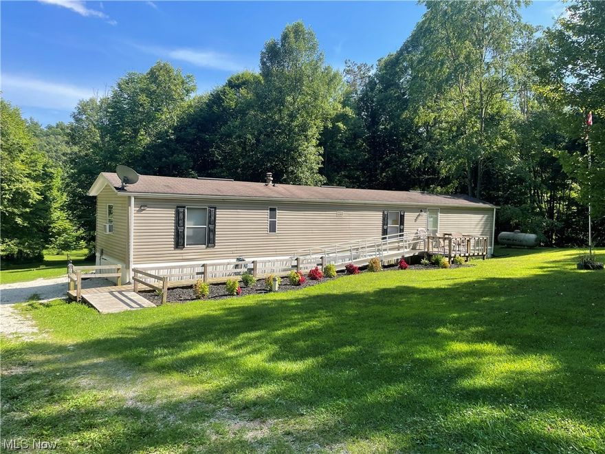 Over 7 acres with remodeled manufactured home in Carroll County. Perfect home to move right in or for a country weekend getaway! Featuring a large screened in back porch, 2 large bedrooms, eat-in kitchen and handicap accessible bathroom this is a one of a kind find.  This home has been an active Air BNB rental for 2 years with solid income and ratings, as well as low operating costs. Home is being sold furnished with everything you need to continue renting for short term rentals or to move right in! Located within 15 minutes of Tappan, Atwood and Leesville Lakes, the private location is unmatched and is a hunter or fisherman's dream. Land has some marketable timber. This property is the perfect mix of open space and woods with a stream running through. Property is Agent Owned.