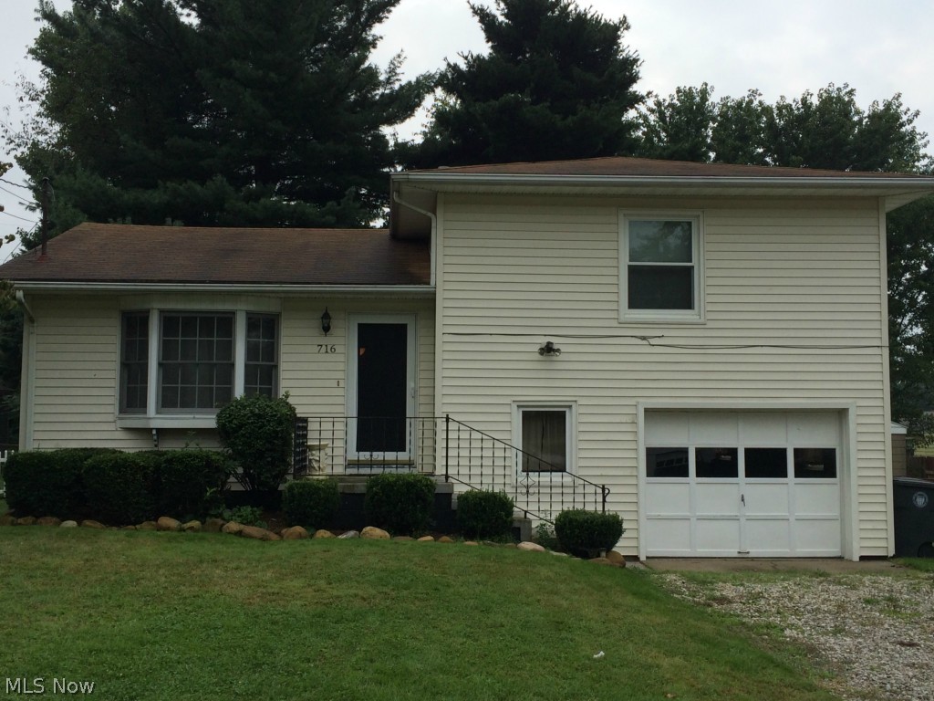 This lovely, well-maintained split-level home has a modern decor and functional living spaces. The open-concept kitchen, living room, and dining area are located on the main floor. On the second level you'll discover two spacious, carpeted bedrooms and a full-bath with shower. The lower level has a half-bath/laundry room combination. Lower level access to 1-car garage as well. Basement with updated furnace and water heater. Additionally, this property is appointed throughout with energy-saving vinyl windows. The exterior has vinyl siding and spacious fenced-in back yard. Schedule your showing today!