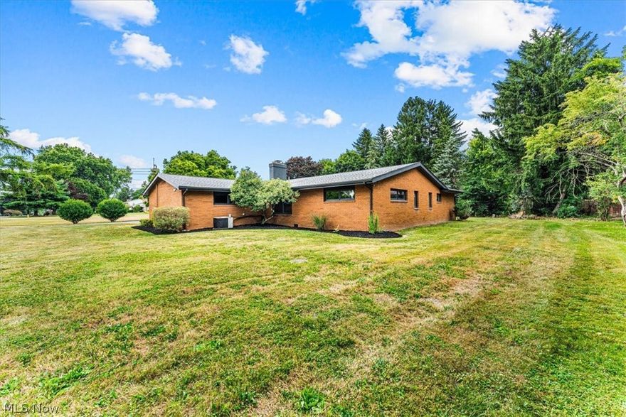 AWESOME 3 Bedroom/2 & 1 Full Bath RANCH Home on almost 2 Acres of Land with Private, Scenic Backyard.  Home Features Include:  Large Front Living Room with Gas Fireplace, PHENOMENAL Eat In Kitchen with tons of cabinets, trendy black appliances, & breakfast area, Formal Dining Room with tons of built in cabinets, Large Master Bedroom, Spacious 2nd Bedroom, & 3rd Bedroom/Library/Office Area.  Home also offers a First Floor Laundry Room.  Sliding Glass door off Living Room leads to the SPECTACULAR Back Patio with views of Private, Scenic, Wooded Backyard.  Home can be Available Immediately.  Updates include:  New Roof in 2020.  New Garage Door in 2021.  Purchase Includes all 3 lots.