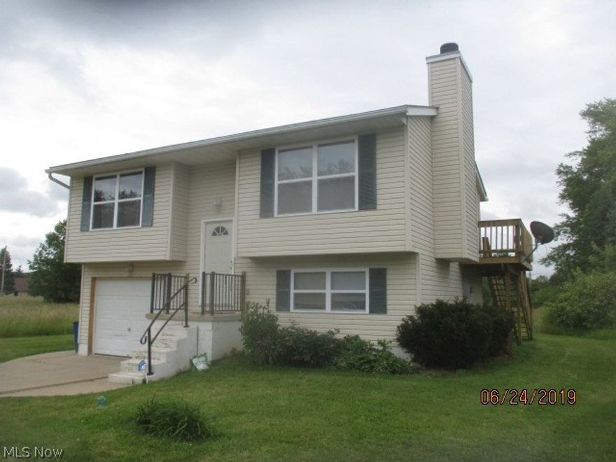 Nice Bi-Level home with an extract pad for parking. wood balcony of of sliding kitchen door with staircase into the backyard. The home has room to build an additional garage as the original owner built home to the right of lot allowing for possible expansion.  The home offers two bedrooms on the main floor and a 3rd bedroom , currently used as an office on the lower level. There is a wood burning fire place off of the great room and an open kitchen/ great room floor plan. Lower level has an attached garage with access off of the laundry room. All appliances stay. Enjoy the Cinnamon Lake are with this great home.

Cinnamon Lake started charging a one time fee of $500 new membership initiation fee started 02/1/19