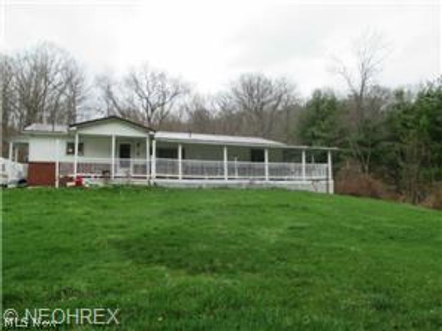 Country living?.  Nice ranch style home.  Kitchen offers beautiful oak cabinets and center island.  Large open floor plan
 nice family room, rec room area.   Easy living with all one floor plan, lots of closets and storage space.  Bathroom has many updates including floor with bath tub.  Wrap around porch/deck area.