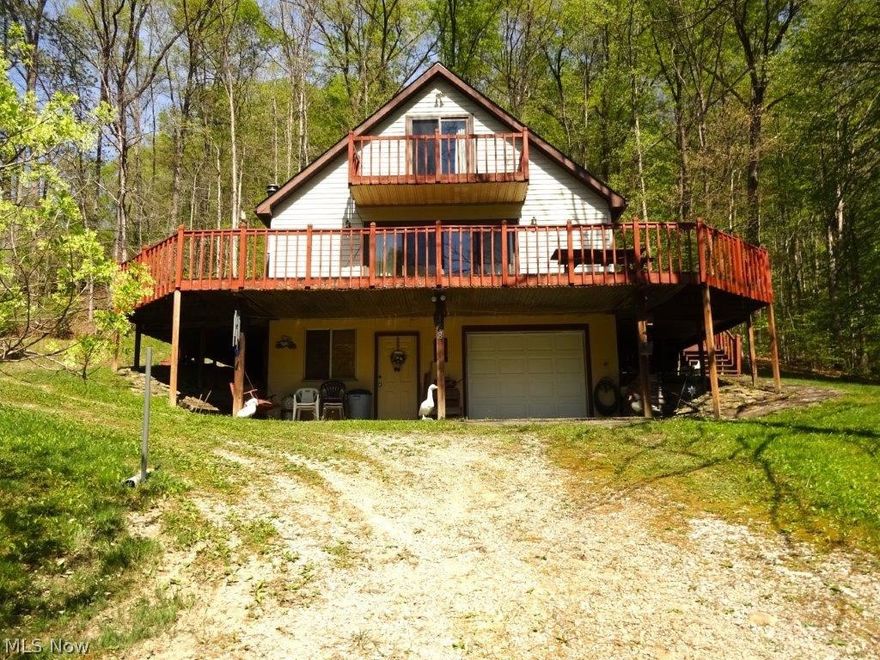 Beautiful private custom built home, 8+ acres, mostly wooded. Beautiful location perfect place for anyone wanting solitude. 3 sides have decks to sit and relax and enjoy the views, wildlife,  wildlife abounds. Great hunting. Main floor features eat-in kitchen, large living room with sliders to walk around deck. Home features 4 bedrooms, 2 1/2 baths. Basement with family room, bath, possible bedroom and garage, storage area. City water, septic. Previous location for mobile home on property. Nice large storage building. This home is located on a hill for great views and privacy. Small stream at bottom of hill. Excellent place to live, relax and enjoy the moon and stars at night. Great 2nd home to vacation and bring your family. Trails throughout to enjoy nature. Come see and enjoy.  *Family room has wood stove *Home is all electric