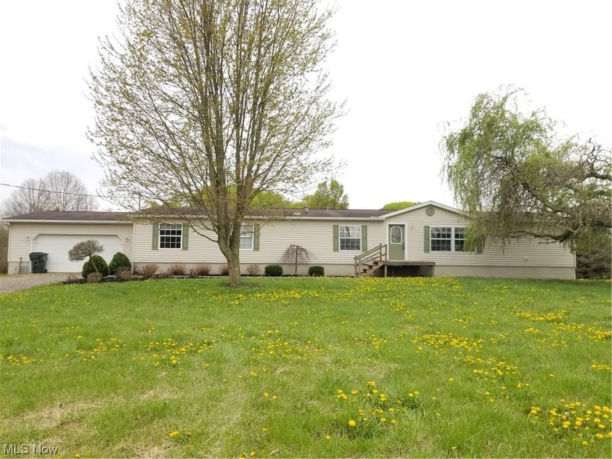 Have you always wanted to live in the country?  Welcome to 14520 Crowl St. SE - lots to love about this home & property!  This is a huge manufactured home with 2280 sq. ft. and features 4 BDs / 3 full baths, Formal LR, Family Room with woodburner, huge Kitchen with tons of oak cabinets & center island, Dinette with doors that lead to huge back deck, Formal DR/office/toy room.  Huge Master BD with 2 closets, Master bath with garden tub, shower stall & 2 sinks, 1st floor laundry, full basement with walk out, 2 car attached garage, outbuilding, pond and 7.39 ACRES!