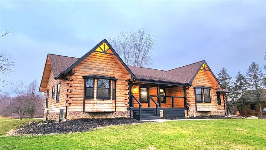 Enjoy every season as if you’re on a rustic retreat with the perfect blend of luxury living elevated with a set back over 300 feet.  Your own park features green space, woods, a stocked-pond with dock and the scenic Rocky River flowing through the back end of 5+ acres.  Wake up with the sunrises on the covered front porch or relax to the sunset in the 4 seasons room and great room.  Exceptional quality craftsmanship displays today’s modern trends throughout this luxury log cabin ranch style home.  One floor living features an Open Floor Plan with formal dining, vaulted and beamed great room with stone fireplace, gourmet kitchen with trendy finishes including double jointed swing spout over the cutting-edge gas stove, center island and pantry, breakfast dinette with bay window for those sunrises in the morning, 4 seasons room with glass doors can be an office/study, 5 total bedrooms including a first floor Owner’s Suite with dynamic Master Bath (dual sinks, jetted shower) and first floor laundry.  The finished lower level has cave potential with 2 bedrooms with baths, garden windows and a spacious recreation room with fireplace.  Tons of storage.  3- car garage.  Move-In Ready, Immediate Occupancy.  12 Minutes to major shopping, dining, medical facilities, and highways. 40 minutes to downtown Cleveland.   A must see!